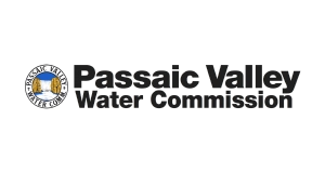 Logo for Passaic Valley Water Commission. The left side shows a circular emblem with a river, trees, and buildings, next to bold black text reading “Passaic Valley Water Commission” on a light gray background.