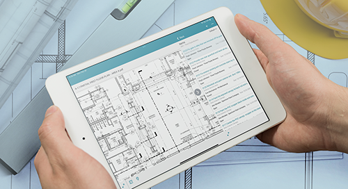 Hands holding a tablet displaying architectural floor plans with notes, overlaid on a background of blueprints, a ruler, and a yellow hard hat.
