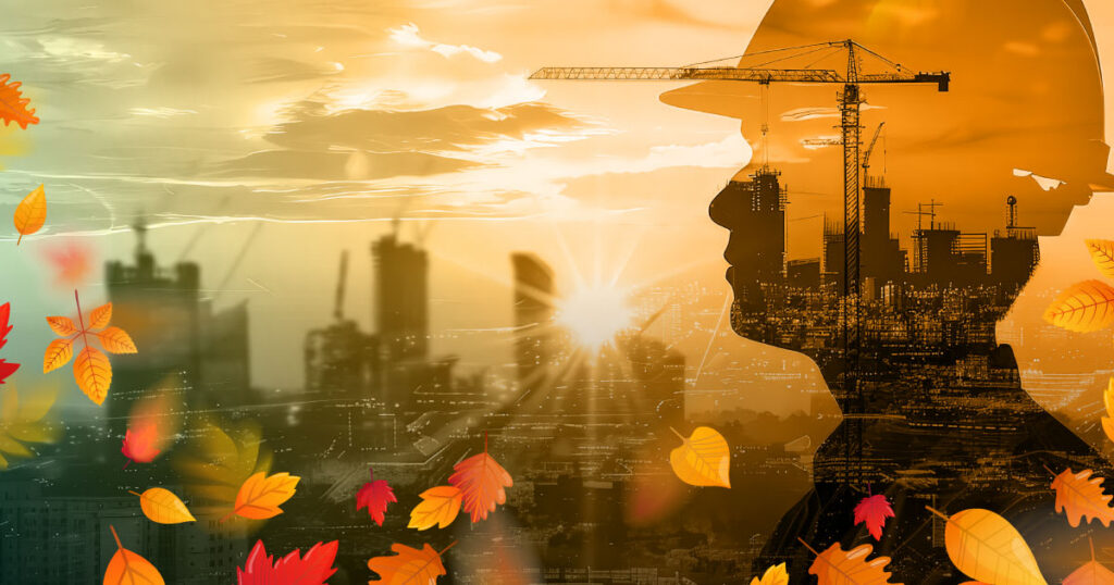 A silhouette of a construction worker in a hard hat overlaid with cranes, buildings, and a sunset. Autumn leaves are scattered in the foreground, blending industry and nature.