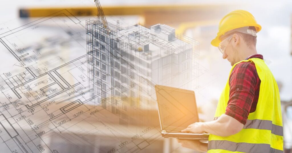 A construction worker in a yellow vest and hard hat uses a laptop, with building blueprints and a digital illustration of a building in the background.