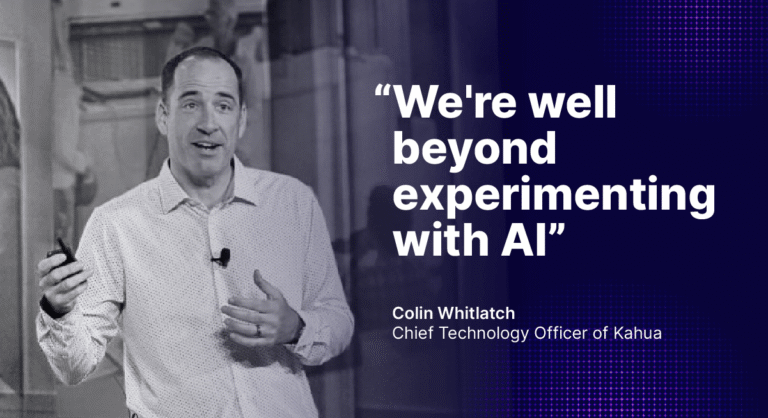 A person speaks on stage holding a remote, with the text: Were well beyond experimenting with AI—Colin Whitlatch, Chief Technology Officer of Kahua.