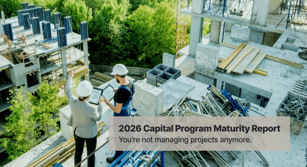 Two people in hard hats stand on a construction site, reviewing a digital tablet, with text overlay reading 2026 Capital Program Maturity Report. Youre not managing projects anymore.